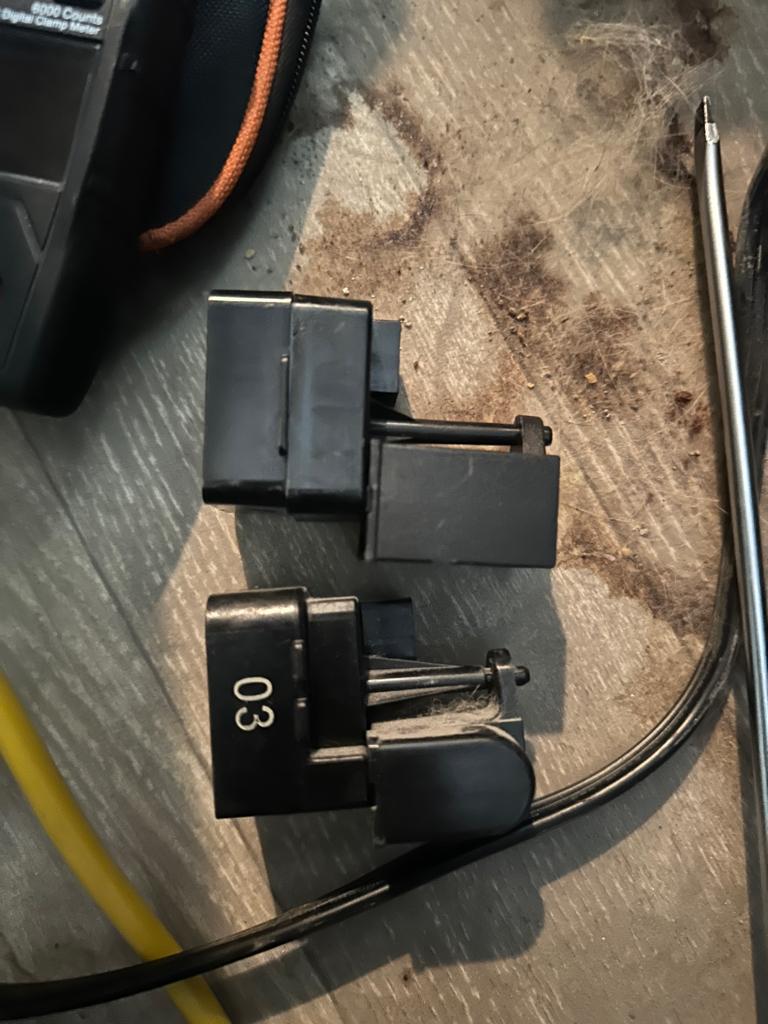 Old and new compressor start relay from a Kenmore refrigerator
