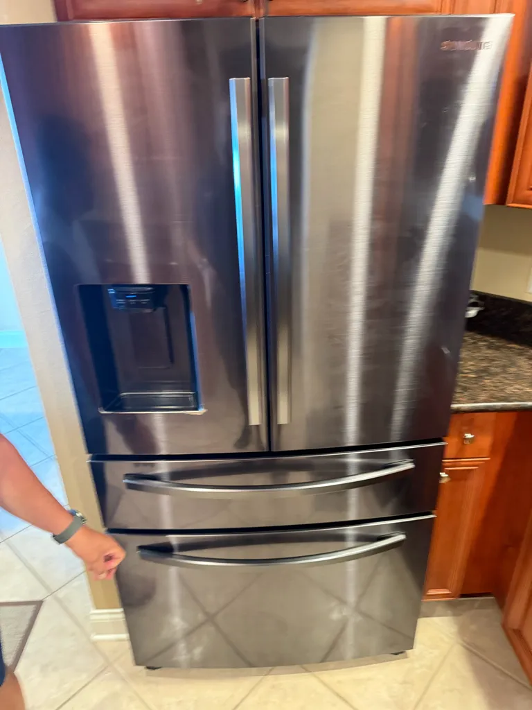 Samsung RF24R7201SG four-door stainless steel refrigerator with ice and water dispenser, Mandalay Ave, Clearwater, FL