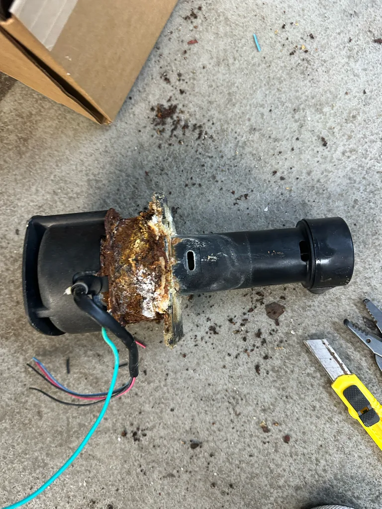 Circulation pump housing from a Hoshizaki ice machine crusted with scale