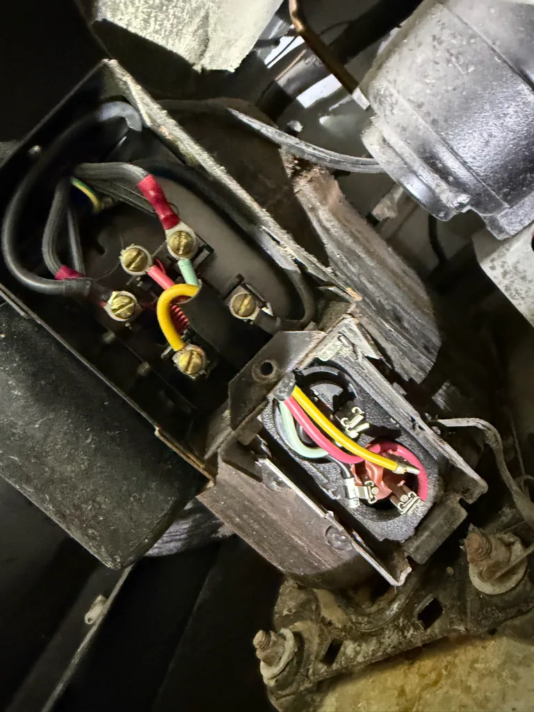 Compressor terminals on a True commercial refrigerator