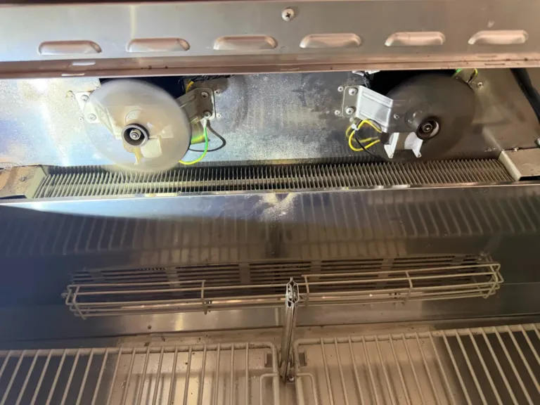 Evaporator fan motors inside a Turbo Air prep table